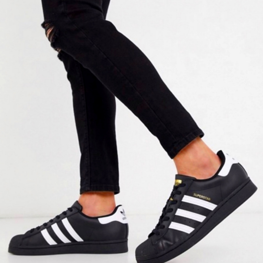 Adidas black and white Superstar sneakers